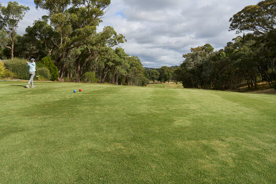 Golfer teeing off at first hole