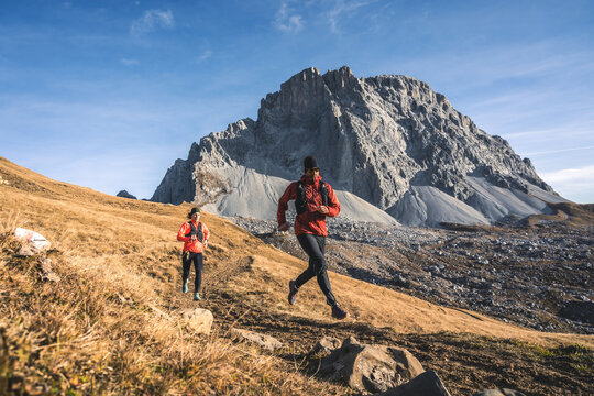 Dynamic runners in the mountains.