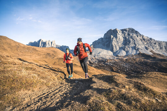 Happy trail runners in the alps.