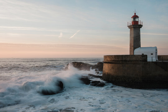 Ancient portuguese lighthouse at sunset