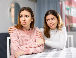 Woman comforting her friend after a domestic quarrel