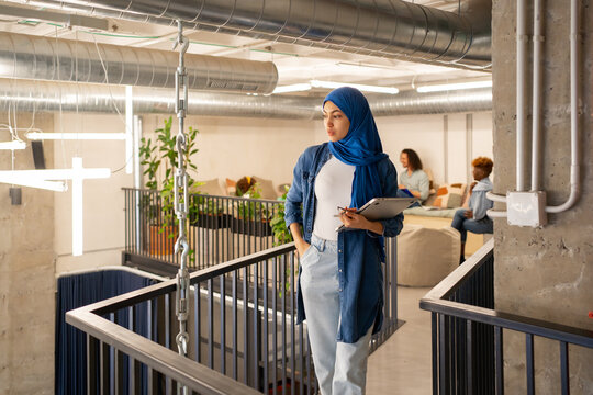 Cool Muslim Woman Standing In The Office.