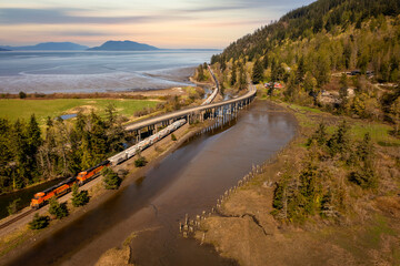 Freight Train Traveling Along Chuckanut Drive in the Town of Blanchard, Washington. Chuckanut Drive...