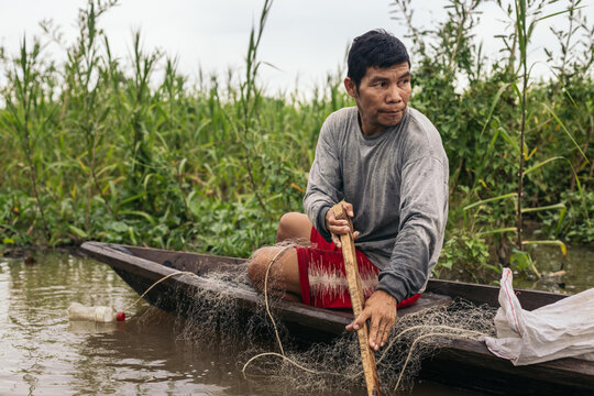 Peruvian man fishing in the amazon river