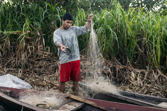 Collecting fishing nets in the amazon river