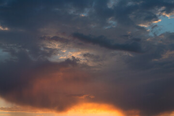 Naklejka na ściany i meble Texture of a red blue sky at sunset after rain