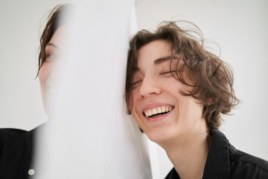 Laughing women divided with cloth