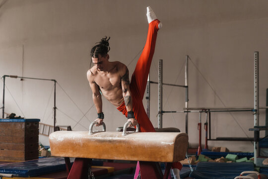 Male Gymnast Working Out On A Pommel Horse