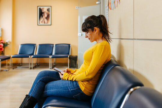 Woman in a waiting room inside the hospital