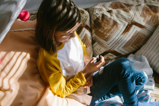 Tween girl chats to friend on smart watch