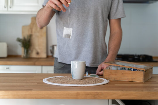 Man making an herbal tea in the kitchen