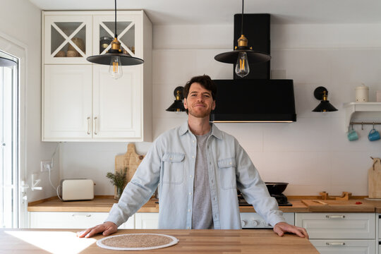 Portrait of confident man at home looking at camera