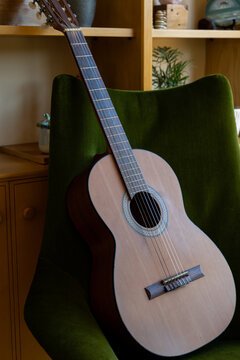 Acoustic guitar on top of couch at home