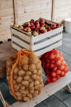 Fresh fruit and vegetables from farm standing on small trestle