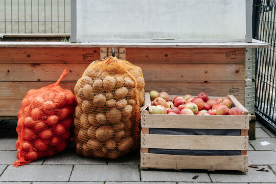 Selection of farm fresh produce with apples, onions and potatoes