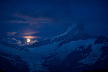 rising full moon over Schreckhorn near Grindelwald