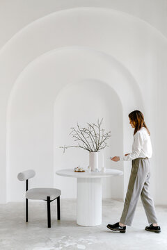 Woman serving table with eggs for Easter holiday
