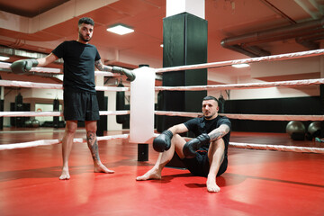Bearded boxer taking break on ring