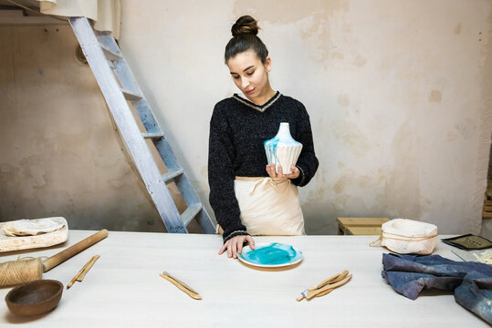 Portrait Of Female Potter With Her Final Product 