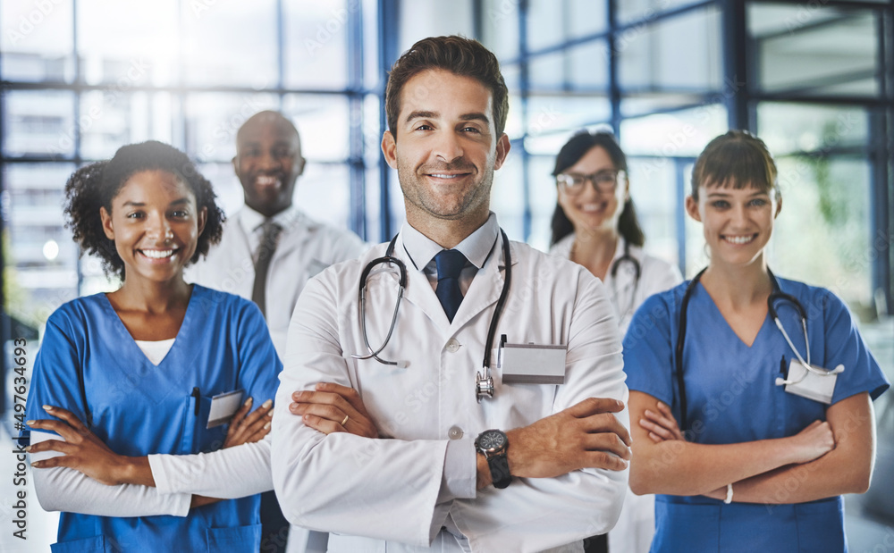 Sticker Improving lives is what we do. Portrait of a diverse team of doctors standing together in a hospital.