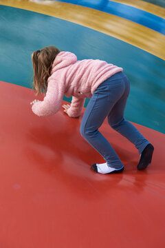 Little girl against a colorful background