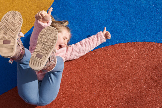 Little girl against a colorful background