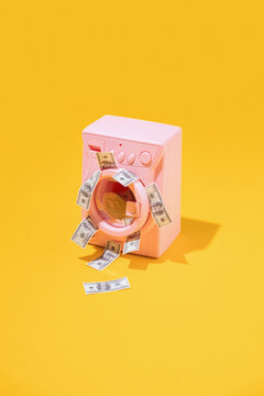 Washing machine washing dollar bills.