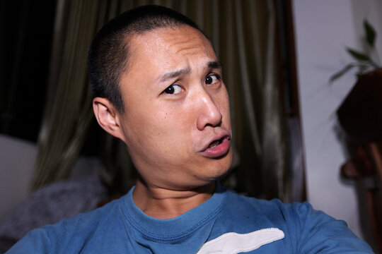 Asian father making funny faces

