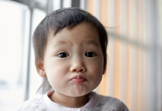 Closeup portrait of funny asian kid

