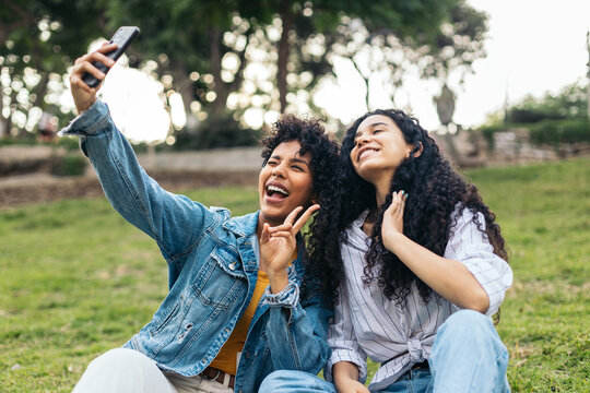 Young women taking selfie in the park