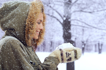 Braving the outdoors isnt all bad. Shot of an attractive woman standing outside in the snow.
