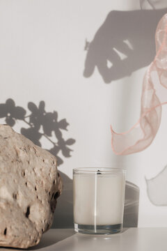 Candle and shadow of woman hand