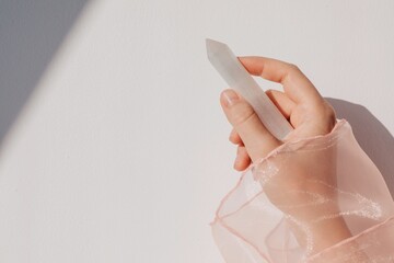 Anonymous woman holding magic crystal