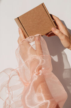 Anonymous woman holding craft box 