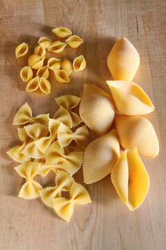 Assorted pasta on cutting board