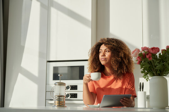 Woman using tablet at home,