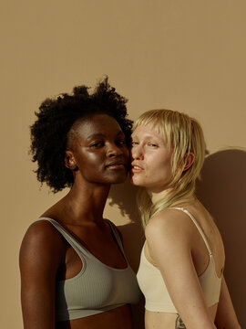 2 confident woman showing love and respect - friendship