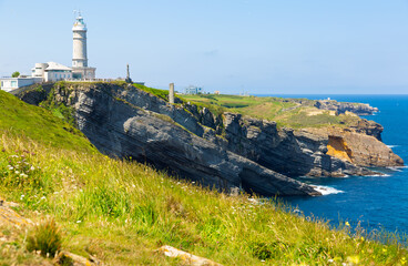 Fototapeta na wymiar Picturesque summer Cabo Mayor landscape with ancient lighthouse over entrance to Bay of Santander, Spain
