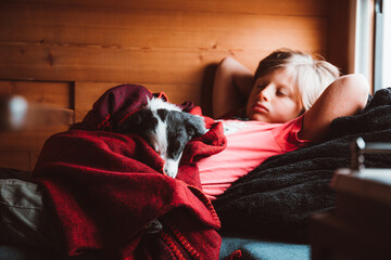 boy and puppy sleeping
