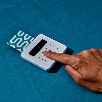 inserts the PIN code in a wireless payment terminal