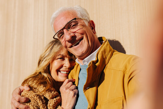 Senior couple taking selfie on smartphone