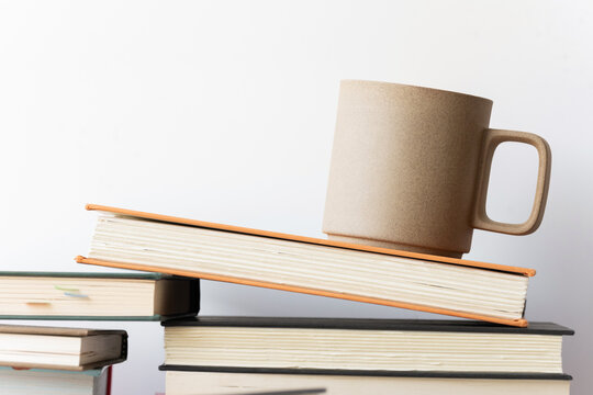 Coffee mug and books