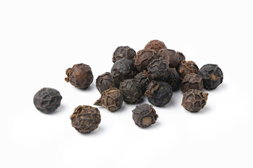 Close-up of black peppercorns (black pepper) isolated on white background.