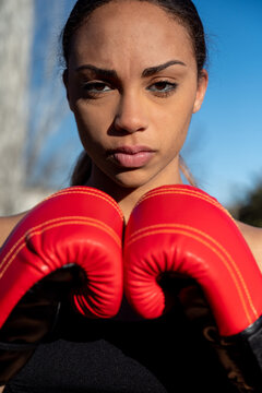 Female boxer bumping fists in gloves