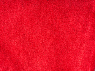 Bright red abstract fabric texture. Closeup.