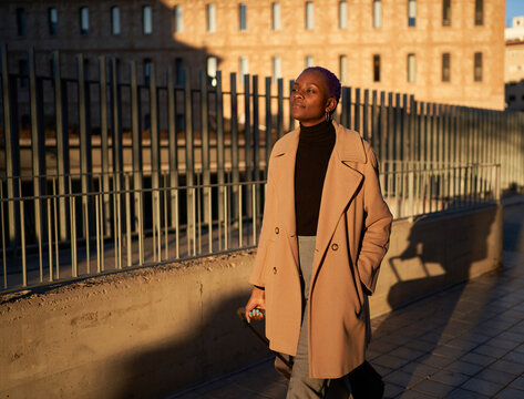 Businesswoman walking on city street