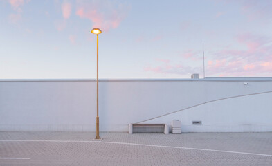 Dreamy detail of bench with city light and sky.