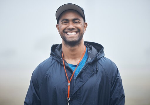 Shaping the athletes of the future. Shot of a young coach on the field.
