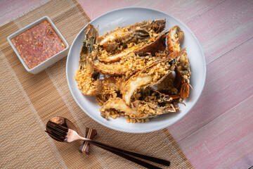 Fried Flathead lobster or Mantis shrimp fried with Garlic and Pepper Served with chili, lime, spicy sauce  , Seafood dish.