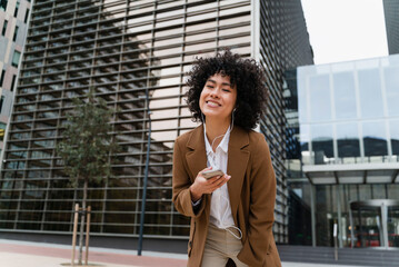 Business Woman Listening Music In The Street